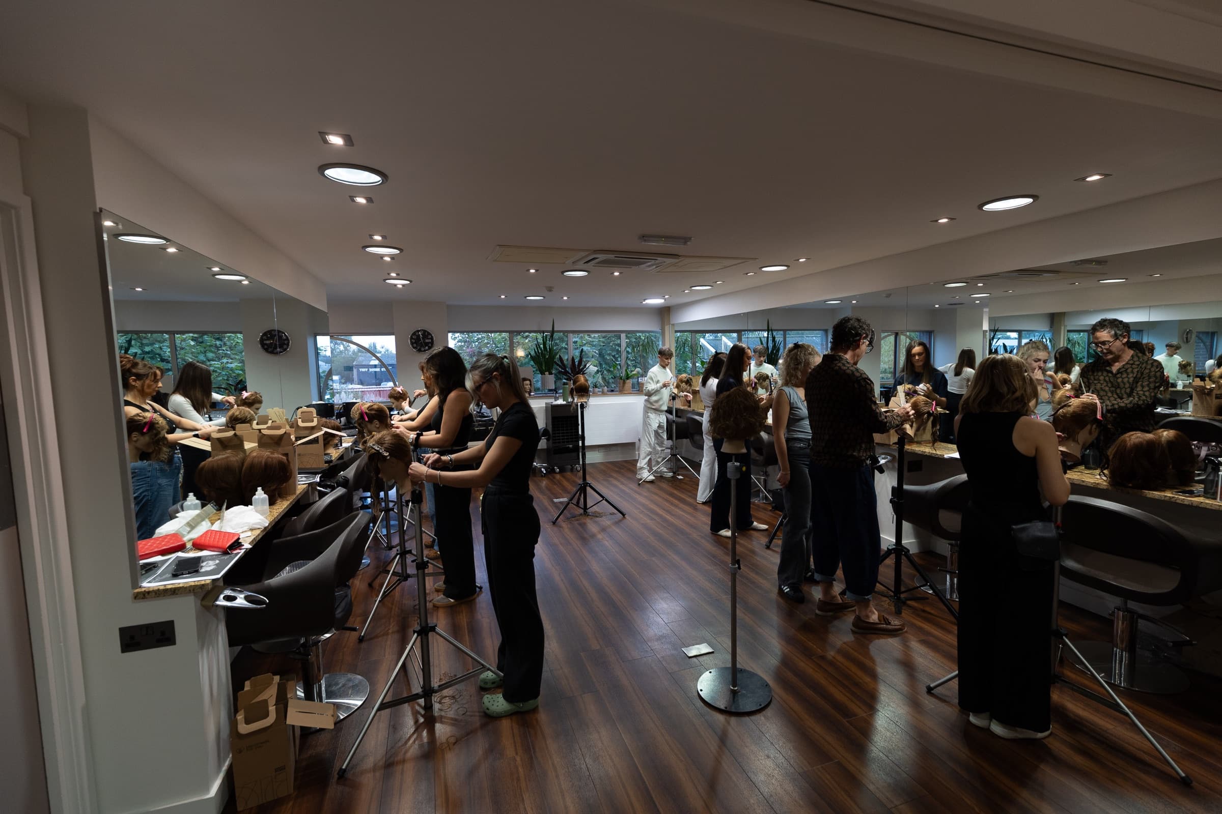 A busy professional salon education session